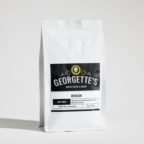 A white stand-up bag of Georgette's Mexican light roast coffee on a clean white background.