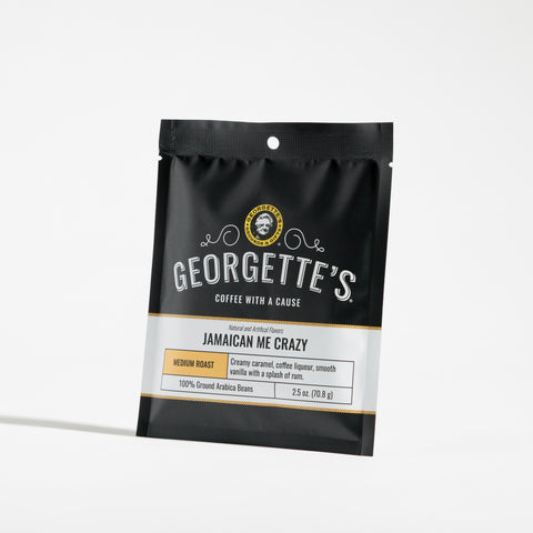 A stand-up pouch of Georgette's Jamaican Me Crazy medium roast coffee on a clean white background.